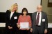 Prof. Suzanne Lunsford and Dr. Nagib Callaos giving Dr. Elena F. Ruiz-Ledesma the best paper award certificate of the session "Empleo de la Tecnología en el Desarrollo de Estudios Contemporáneos." The title of the awarded paper is "Aprendizaje Significativo: El Caso de la Computación, la Matemática y la Música."